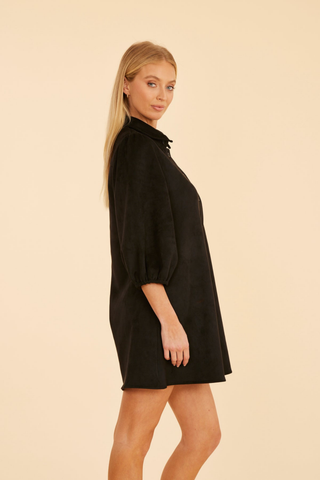 Dolce Cabo A-Line Suede Dress in Black featuring soft faux suede, a collared button front, three-quarter puff sleeves, and an A-line mini silhouette.