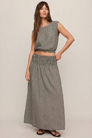 Model wearing the Z Supply Merit Gingham Top in Black with a sleeveless silhouette and elasticized hem.