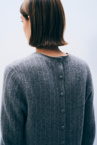 White + Warren Cashmere Blend Fringe Top in Dark Steel Heather featuring a crew neckline, long sleeves, relaxed silhouette, and textured fringe detailing along the hem.