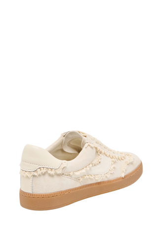 Ivory suede lace-up sneaker with frayed detailing and gum sole from Dolce Vita on a white background.