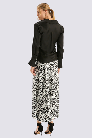 Tyler Boe Astrid Charmeuse Blouse in Black featuring a silky draped cowl neckline, pointed collar, and long statement sleeves.