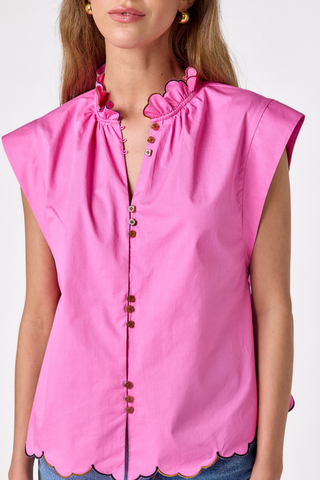 Model wearing the Crosby Fritzy Top in Poppy Pink with cap sleeves and a relaxed silhouette.