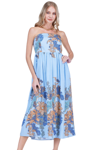 Woman wearing a blue floral dress on a white background