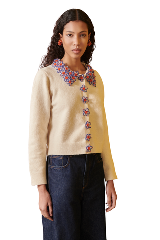 Celia B Bloom Cardigan in cream with colorful blue and orange floral embellishments along the neckline and front.