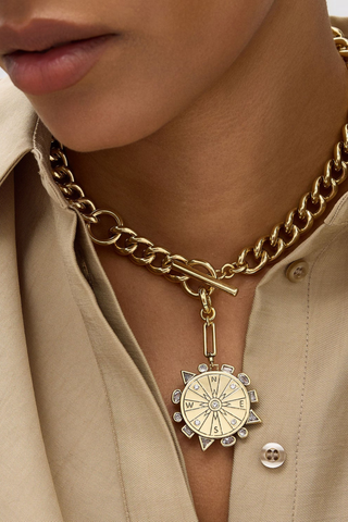 Mignonne Gavigan Odyssey Necklace in Baby Blue featuring a gold chain and removable blue compass charm.