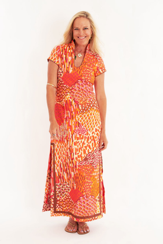 C.K. Bradley Tarpon Dress in Popplet Autumn orange and pink print with short sleeves and a flowing maxi silhouette.