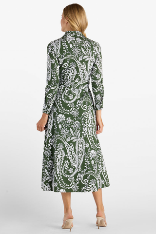 Jude Connally Kitty Dress in Wild Paisley Navy Loden featuring a green and cream paisley print, long sleeves, point collar, and belted midi silhouette.