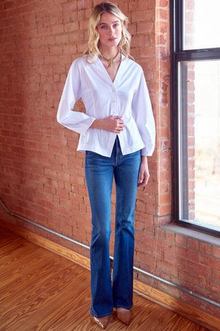 Finley Mia Barrel Sleeve Top in White featuring a V-neck button front, fitted waist, peplum silhouette, and long gathered barrel sleeves.