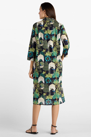 Model wearing the Jude Connally Kallan Dress in Peacock Garden Black with a relaxed midi caftan silhouette.