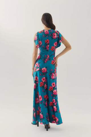 Hutch Rosalee Dress in Emerald/Pink featuring a vibrant emerald green background, bold pink floral print, high neckline, short sleeves, and flowing maxi silhouette.