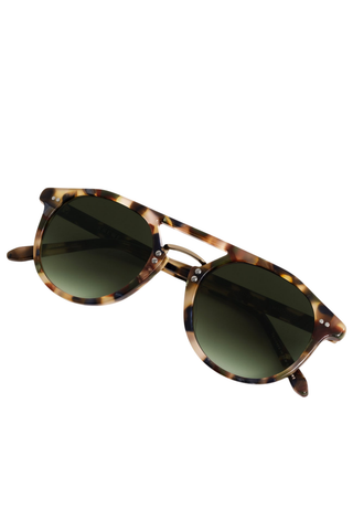 Krewe Markle Sunglasses in Tuscan Tortoise featuring a rounded tortoise acetate frame, gold-tone metal bridge, and dark green gradient lenses.