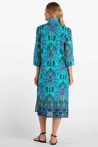 Model wearing the Jude Connally Kallan Dress in Peacock Garden Black featuring a colorful Peacock Garden print and midi silhouette.