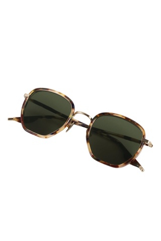 Krewe Peyton Sunglasses in Tuscan Tortoise featuring a tortoise acetate frame, gold-tone hardware, and dark green lenses.