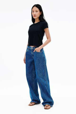 SLVRLAKE Mica Jeans in Sweet Memory featuring a relaxed low-rise fit, wide-leg silhouette, and timeless mid-indigo wash.