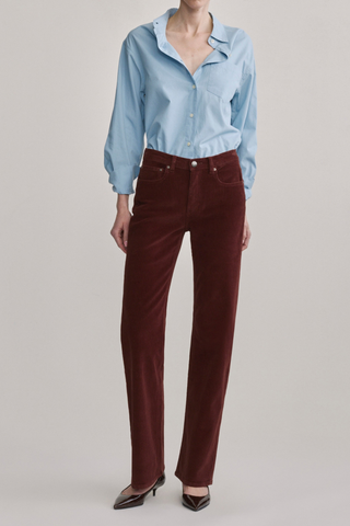 DL1961 Bella Slim Boot Jean in Syrah Cord featuring a mid-rise slim bootcut silhouette in muted red corduroy.