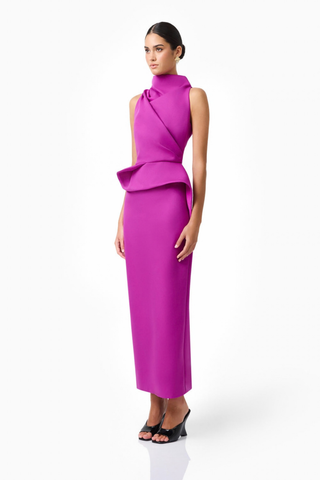 Elliatt Lioris Gown in Orchid featuring a rich purple hue, high neckline, asymmetric draped peplum, and floor-length silhouette.