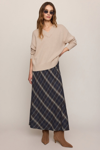 Z Supply Crestview Plaid Skirt in Eclipse featuring a dark neutral plaid pattern, bias-cut midi silhouette, and flowing hem.