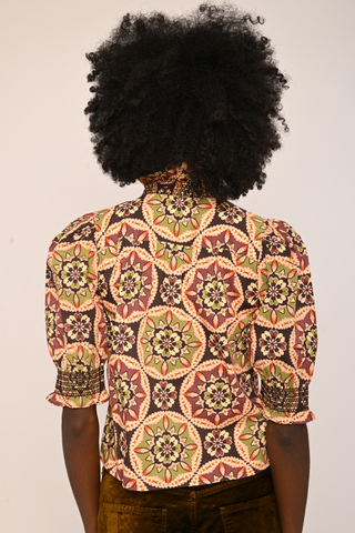 Love the Label Zuri Top in Letters to Hattie Medallion featuring a colorful medallion print, button front, collar, and short puff sleeves.