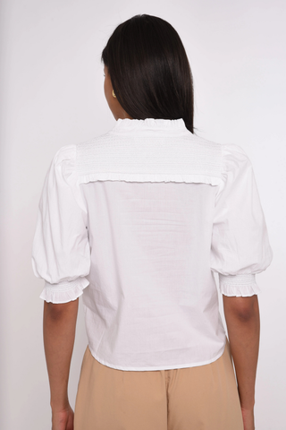 Love the Label Zinny Top in Bright White featuring puff sleeves, delicate trim detailing, smocked cuffs, and a feminine button-front blouse silhouette