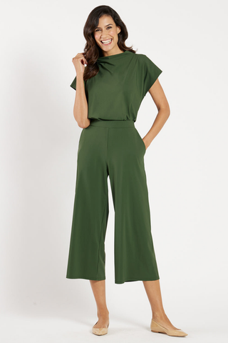 Model wearing the Jude Connally Lolly Pants in Loden with a cropped wide-leg silhouette.