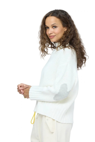 Kerri Rosenthal Marlow Imperfect Heart Sweater in Natural featuring a soft ivory rib knit, mock neck, and contrast heart elbow patches.