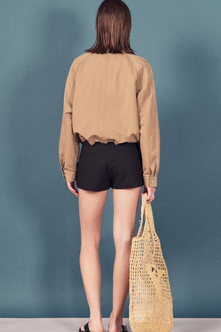 English Factory Lightweight Bomber Jacket in beige with long sleeves, front pockets, and an adjustable drawstring hem.