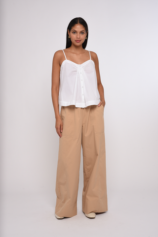 Model wearing the Love the Label Ramona Pant in Sand Dust featuring a high-rise waist and wide-leg silhouette.