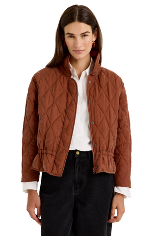 Marie Oliver Haisley Jacket in Tortoise featuring a quilted rust-brown design, funnel neckline, and adjustable drawstring waist.