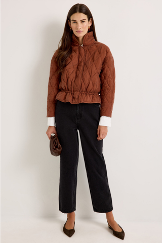 Marie Oliver Haisley Jacket in Tortoise featuring a quilted rust-brown design, funnel neckline, and adjustable drawstring waist.