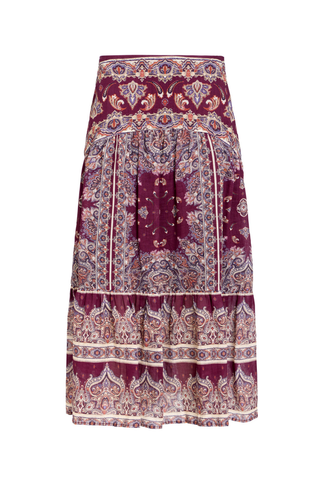 Holland Skirt in Majesty featuring a purple and neutral paisley print, fitted drop waist, and flowing tiered midi silhouette.
