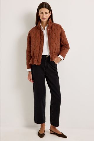 Marie Oliver Haisley Jacket in Tortoise featuring a quilted rust-brown design, funnel neckline, and adjustable drawstring waist.