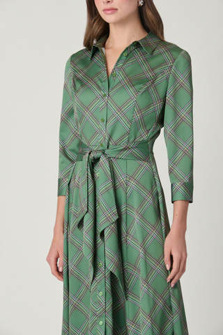 Shoshanna Laine Dress in Olive Multi featuring a printed satin charmeuse fabrication, collared button front, tie waist, and asymmetrical midi hem.