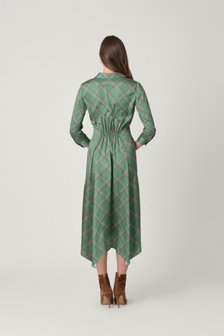 Shoshanna Laine Dress in Olive Multi featuring a printed satin charmeuse fabrication, collared button front, tie waist, and asymmetrical midi hem.