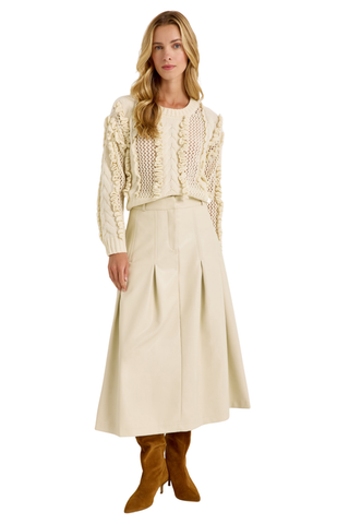 Faith Skirt in Polar featuring a cream vegan leather midi silhouette with a fitted waist and inverted box pleats.