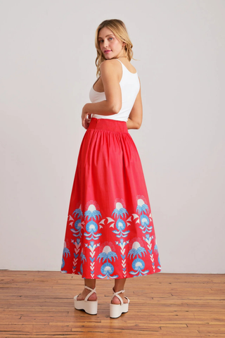Sheridan French Lillian Skirt in Red Thistle featuring vibrant red print, maxi silhouette, smocked waistband, and colorful border detailing