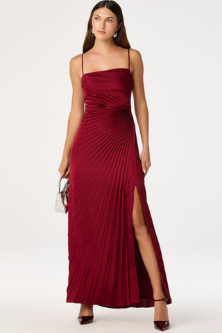ASTR Paulette Dress in Wine featuring spaghetti straps, draped neckline, pleated floor-length silhouette, and thigh-high side slit.