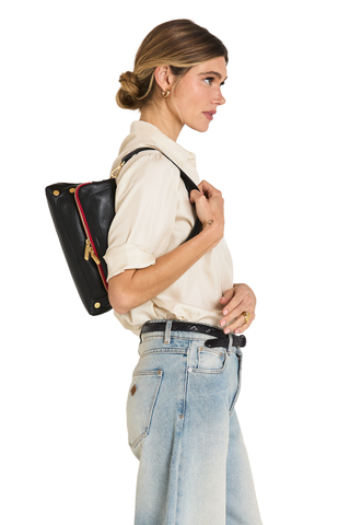 Hammitt Beverly Medium Handbag in black pebbled leather with brushed gold hardware and signature red zipper.