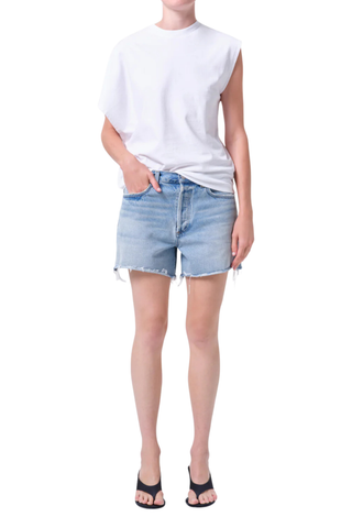 AGOLDE Nye Short in Post medium wash denim featuring a relaxed fit and longer inseam with a clean hem