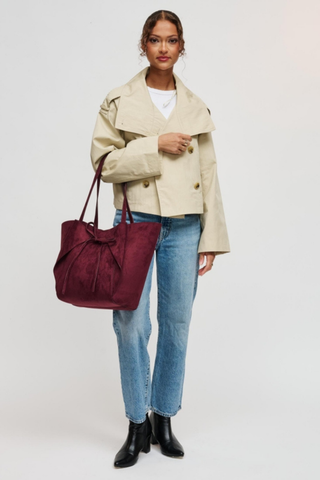 Urban Expressions Soren Tote in Burgundy vegan suede with long shoulder straps, bow-front detail, and matching zip pouch.