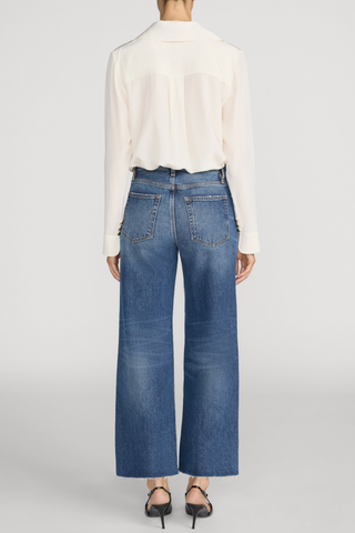 FRAME The Swing jeans in Lucky Raw After featuring a medium blue wash, high rise, cropped wide-leg silhouette, and raw hem.