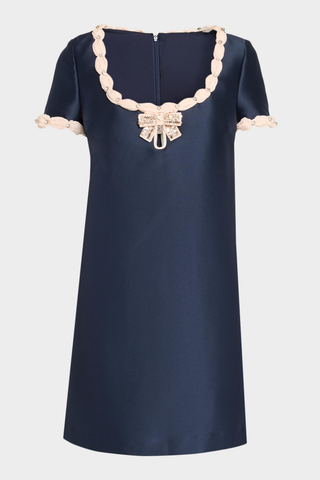 Navy Mikado Shift Cocktail Dress with short sleeves, contrast embellished neckline, bow detail, and center-front keyhole.