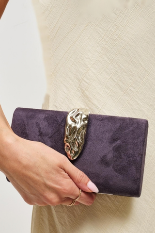 Urban Expressions Babe Clutch in Grape featuring soft purple faux suede, a sculptural metallic clasp, and removable chain strap.
