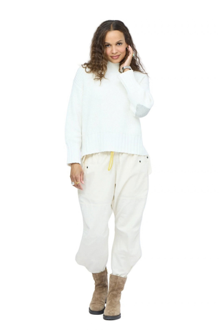 Kerri Rosenthal Marlow Imperfect Heart Sweater in Natural featuring a soft ivory rib knit, mock neck, and contrast heart elbow patches.