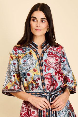 Mestiza Aracati Mini Dress in Venetian Patchwork featuring a colorful mixed print, mandarin collar, three-quarter sleeves, and self-tie waist.