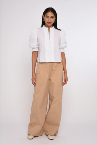 Love the Label Zinny Top in Bright White featuring puff sleeves, delicate trim detailing, smocked cuffs, and a feminine button-front blouse silhouette