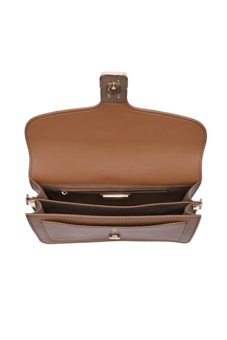 Urban Expressions Coco Crossbody in Camel featuring smooth vegan leather, a structured flap silhouette, buckle detail, and adjustable strap.