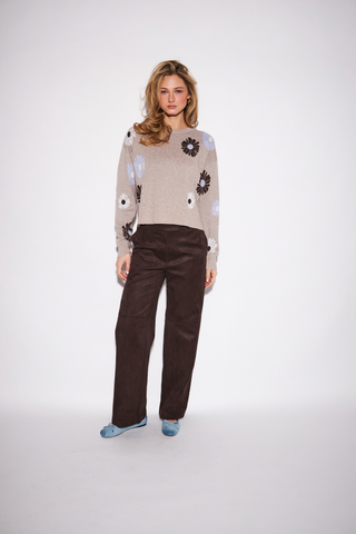 JOHN & JENN Presley Sweater in Rose Bouquet featuring a neutral knit with scattered blue, white, and brown floral motifs.
