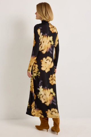 Marie Oliver Paxton Dress in Lush featuring oversized golden floral print on a black stretch jersey midi silhouette.