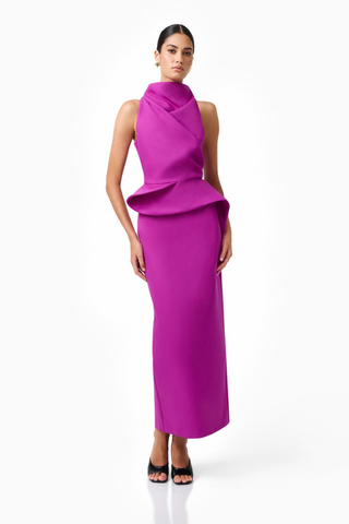Elliatt Lioris Gown in Orchid featuring a rich purple hue, high neckline, asymmetric draped peplum, and floor-length silhouette.