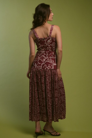 Red floral midi dress with a fitted bodice and flowing skirt.